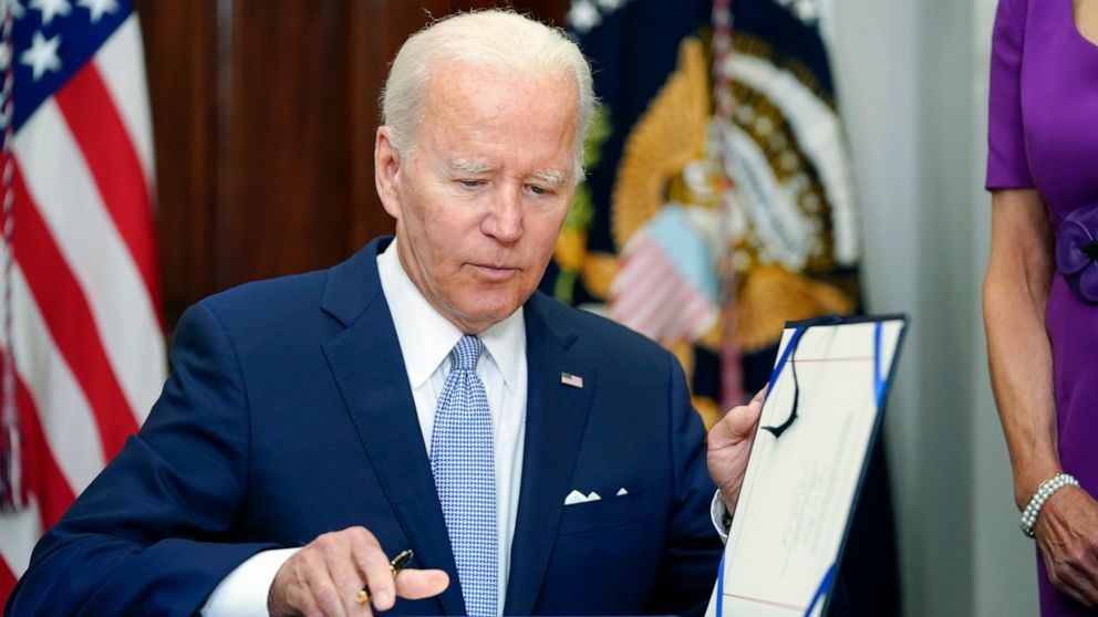 Biden celebration of new gun law clouded by latest shooting