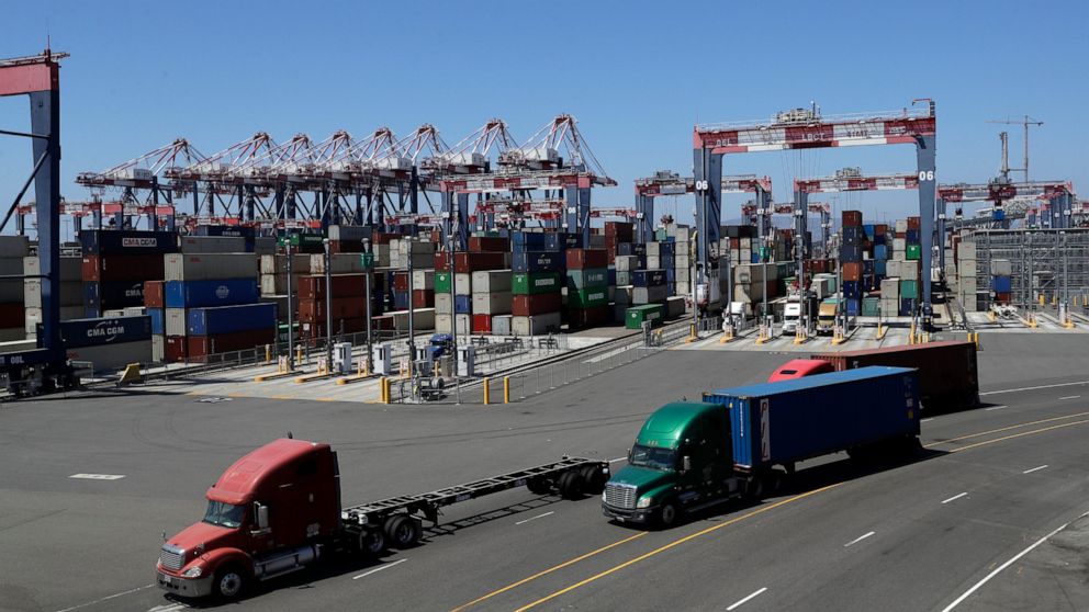 FILE - In this Aug. 22, 2018, file photo, trucks travel along a loading dock at the Port of Long Beach in Long Beach, Calif. The California Air Resources Board is scheduled to vote Thursday, June 25, 2020, on new first-in-the-nation rules to require 