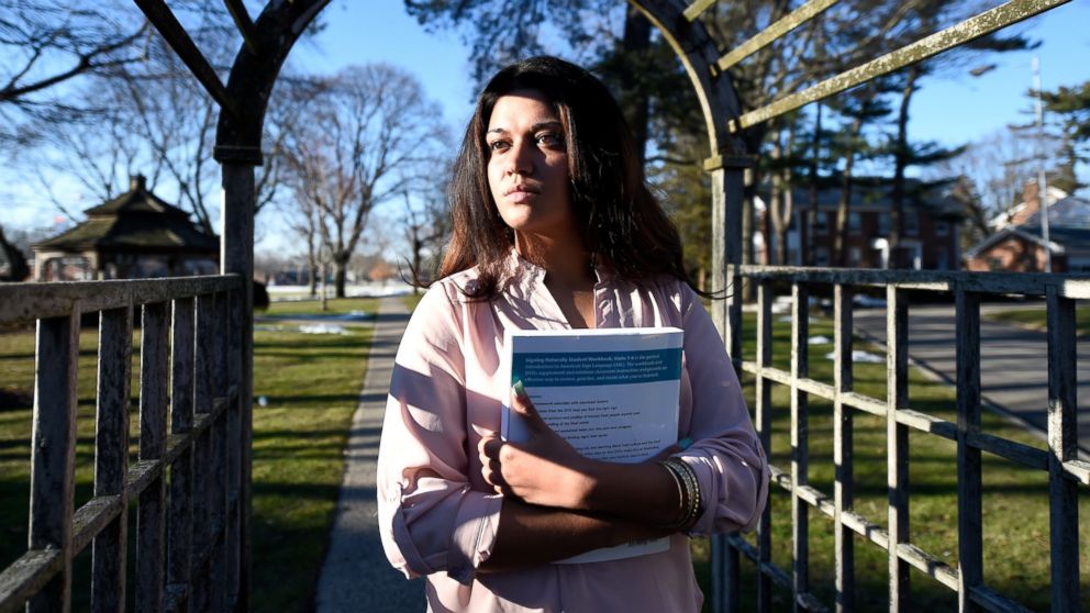 FILE - In this Feb. 2, 2016, file photo, Naila Amin, 26, holds a book from one of the classes she was taking at Nassau Community College in Garden City, N.Y. According to data provided to The Associated Press, the U.S. approved thousands of requests 