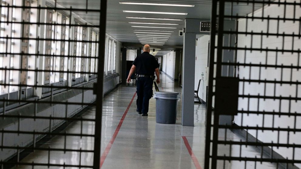 FILE - A Rikers Island juvenile detention facility officer walks down a hallway of the jail, Thursday, July 31, 2014, in New York. It's hard to find anyone on board with New York Gov. Kathy Hochul's plan to toughen the state's bail laws, two years af