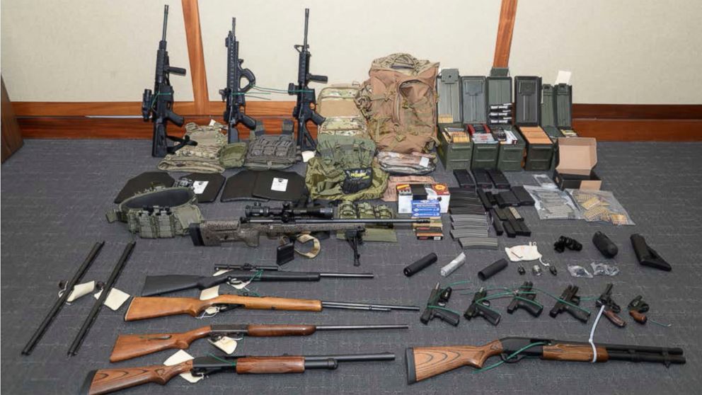 This image provided by the U.S. District Court in Maryland shows a photo of firearms and ammunition that was in the motion for detention pending trial in the case against Christopher Paul Hasson. Prosecutors say that Hasson, a Coast Guard lieutenant 