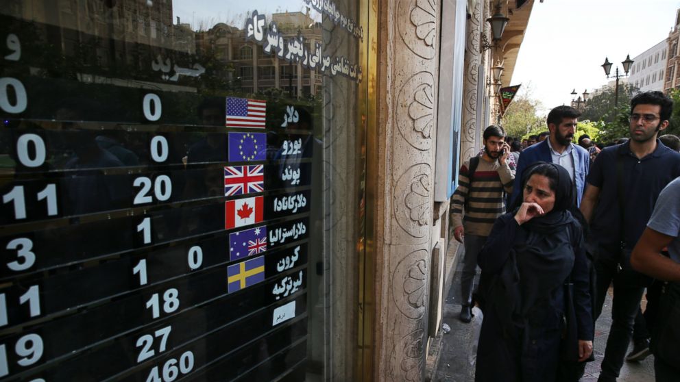 FILE - In this Oct. 2, 2018, file photo, an exchange shop displays rates for various currencies, in downtown Tehran, Iran. The Trump administration is closely eyeing efforts in Europe to set up an alternative money payment channel to ease doing busin