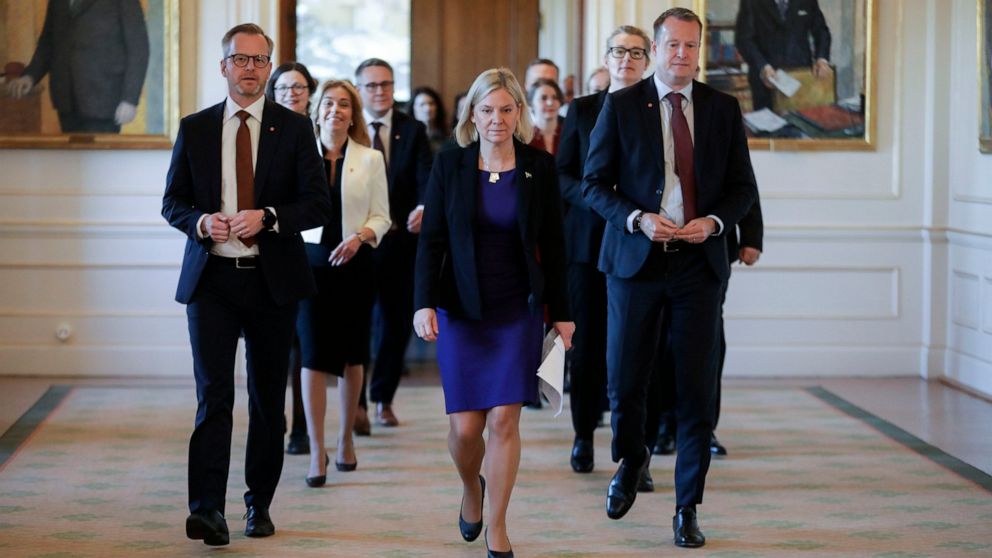 Swedish Prime Minister Magdalena Andersson, center, is followed by her new cabinet members as they arrive for a press conference, in Stockholm, Tuesday, Nov. 30, 2021. Andersson, the first woman to ever hold that post in Sweden, has presented her one