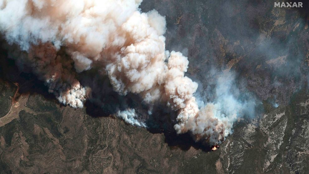 FILE - This satellite image provided by Maxar Technologies shows the active fire lines of the Hermits Peak wildfire, in Las Vegas, N.M., May 11, 2022. More than 5,000 firefighters are battling multiple wildland blazes in dry, windy weather across the
