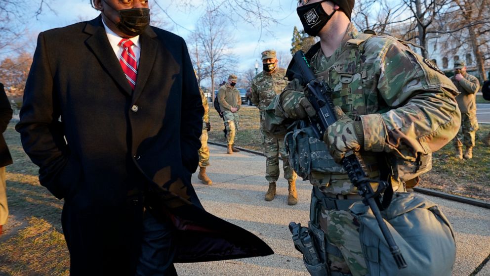 Secretary of Defense Lloyd Austin visits National Guard troops deployed at the U.S. Capitol and its perimeter, Friday, Jan. 29, 2021 on Capitol Hill in Washington. (AP Photo/Manuel Balce Ceneta, Pool)