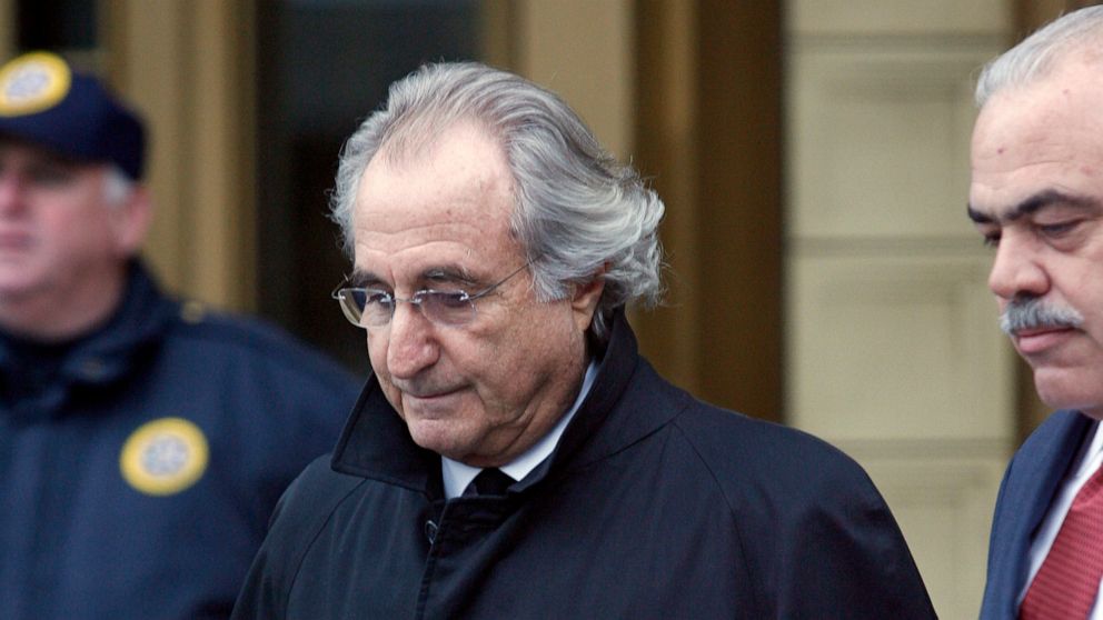 FILE - In this Jan. 14, 2009 file photo, Bernie Madoff leaves Federal Court in New York. Madoff, the financier who pleaded guilty to orchestrating the largest Ponzi scheme in history, died early Wednesday, April 14, 2021, in a federal prison, a perso