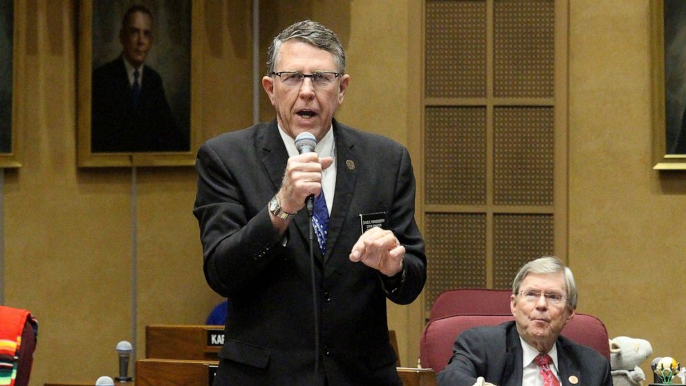 FILE - Republican state Sen. David Farnsworth urges members to reject a move to adjourn the legislative session as GOP Sen. Vince Leach looks on at the state Capitol in Phoenix, Friday, May 8, 2020. Donald Trump on Wednesday, June 29, 2022, endorsed 