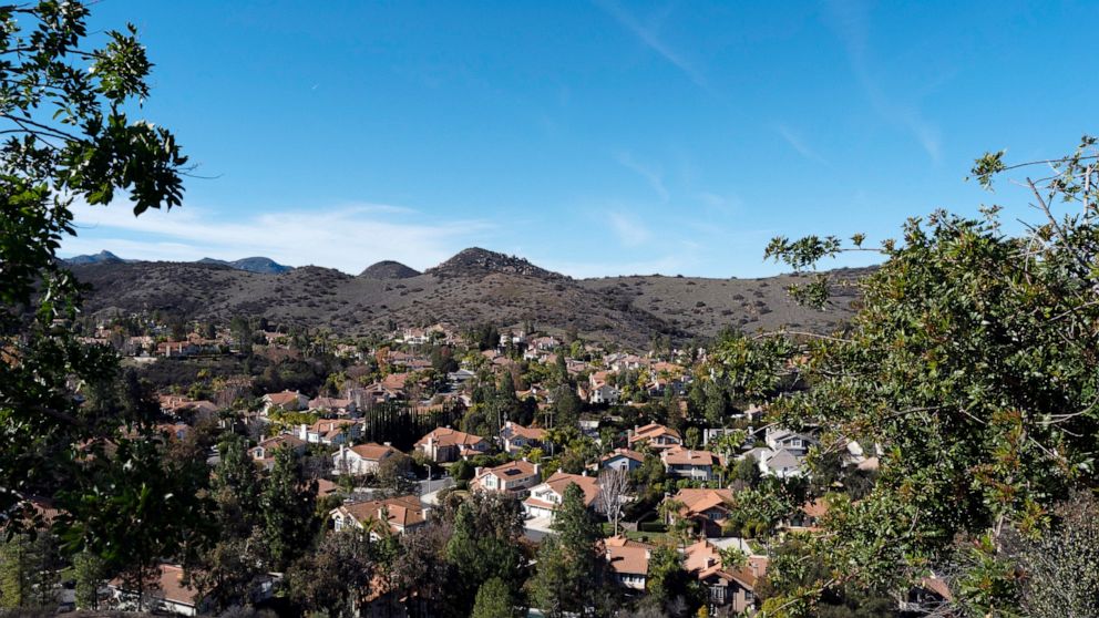 Homes are seen from Las Virgenes Reservoir in Westlake Village, Calif., Wednesday, Jan. 5, 2022. The community, one of the wealthiest neighborhoods in the Greater Los Angeles Area, is served by the Las Virgenes Municipal Water District. (AP Photo/Jae