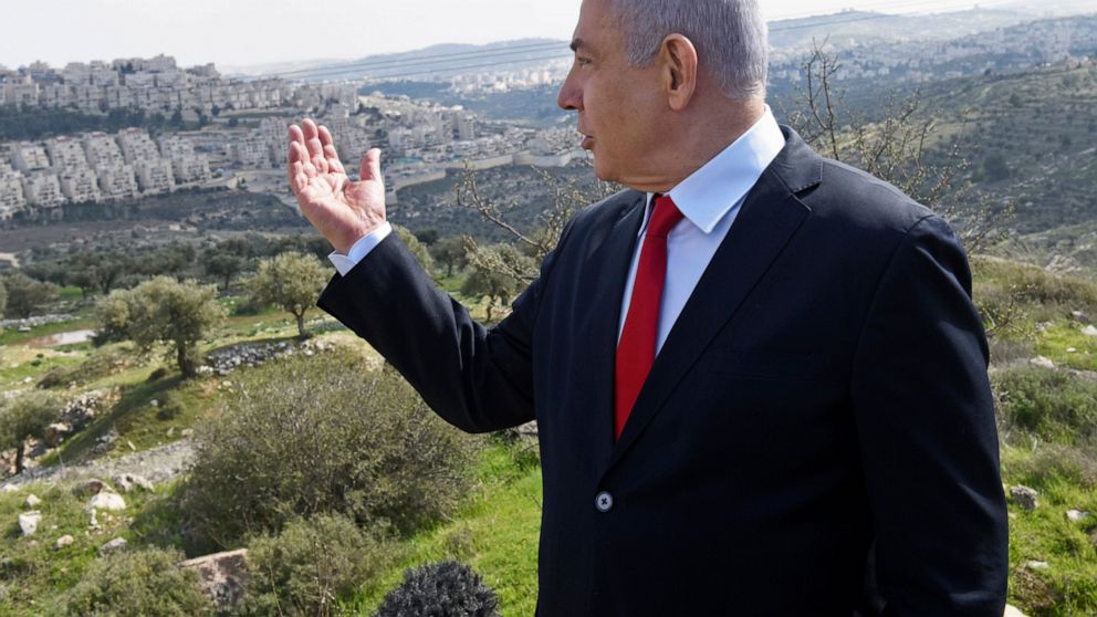 FILE - In this Feb. 20, 2020 file photo, Israeli Prime Minister Benjamin Netanyahu visits the area where a new neighborhood is to be built in the East Jerusalem settlement of Har Homa. A senior Emirati official warned Wednesday, June 17, 2020 that Is