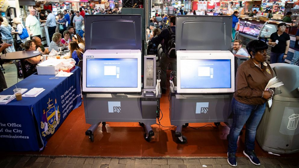 In this Thursday, June 13, 2019 photo, ExpressVote XL voting machines are displayed during a demonstration at the Reading Terminal Market in Philadelphia. The machines are made by Election Systems & Software, one of three voting-machine companies tha