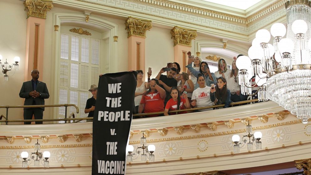 Opponents of recently passed legislation to tighten the rules on giving exemptions for vaccinations, demonstrate against a companion measure the state Senate gallery at the Capitol in Sacramento, Calif., Monday, Sept. 9, 2019. The state Assembly had 