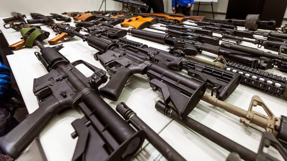 FILE - In this Dec. 27, 2012, file photo, a variety of military-style semi-automatic rifles obtained during a buy back program are displayed at Los Angeles police headquarters. The 9th U.S. Circuit Court of Appeals overturned two lower court judges a