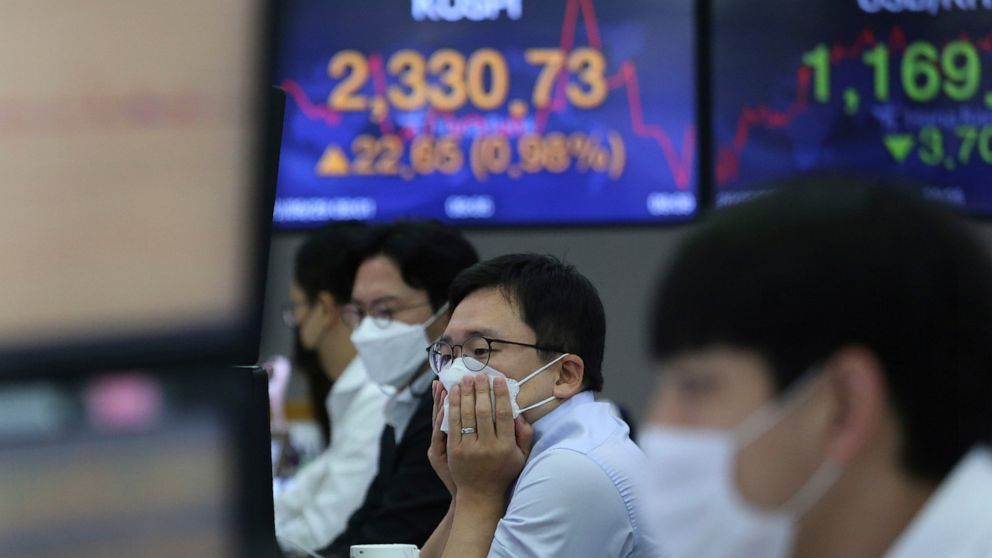 A currency trader watches monitors at the foreign exchange dealing room of the KEB Hana Bank headquarters in Seoul, South Korea, Tuesday, Sept. 29, 2020. Asian stocks were mixed Tuesday after Wall Street recovered some of this month's losses as inves