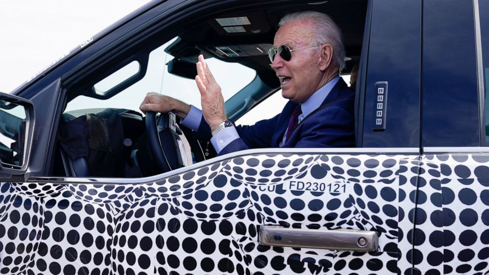 Biden back behind the wheel, zooming away in electric truck