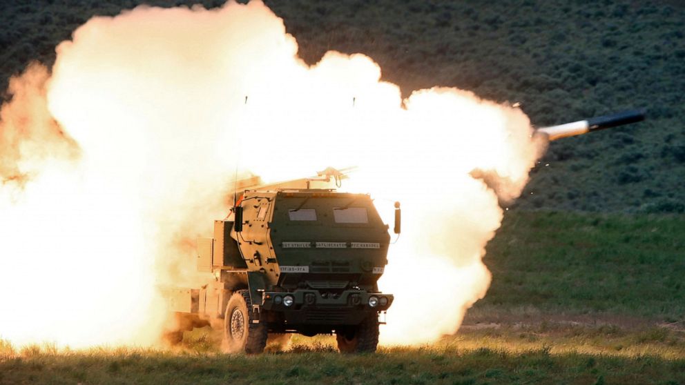 FILE - In this May 23, 2011, file photo a launch truck fires the High Mobility Artillery Rocket System (HIMARS) produced by Lockheed Martin during combat training in the high desert of the Yakima Training Center, Wash. U.S. officials will send anothe