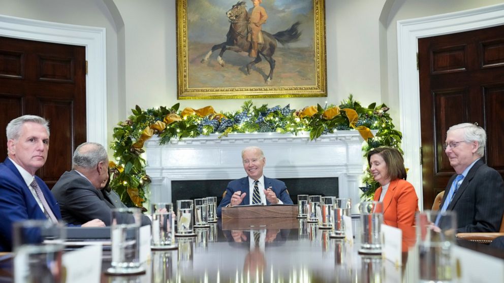 President Joe Biden, center, at the top of a meeting with congressional leaders to discuss legislative priorities for the rest of the year, Tuesday, Nov. 29, 2020, in the Roosevelt Room of the White House in Washington. From left are House Minority L