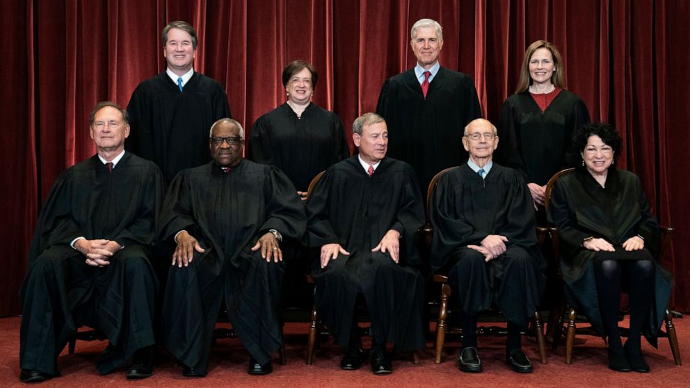 FILE - In this April 23, 2021, file photo, members of the Supreme Court pose for a group photo at the Supreme Court in Washington. Seated from left are Associate Justice Samuel Alito, Associate Justice Clarence Thomas, Chief Justice John Roberts, Ass
