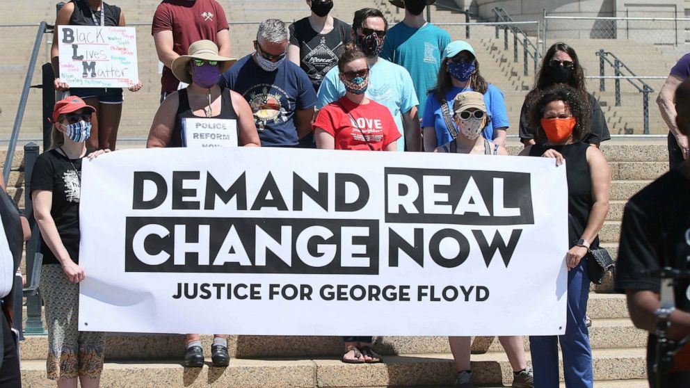 FILE - In this June 12, 2020, file photo, protesters demanding change in the wake of the death of George Floyd hold a media briefing outside the Minnesota State Capitol, in St. Paul, Minn. Minnesota’s top Democratic and Republican lawmakers reached a