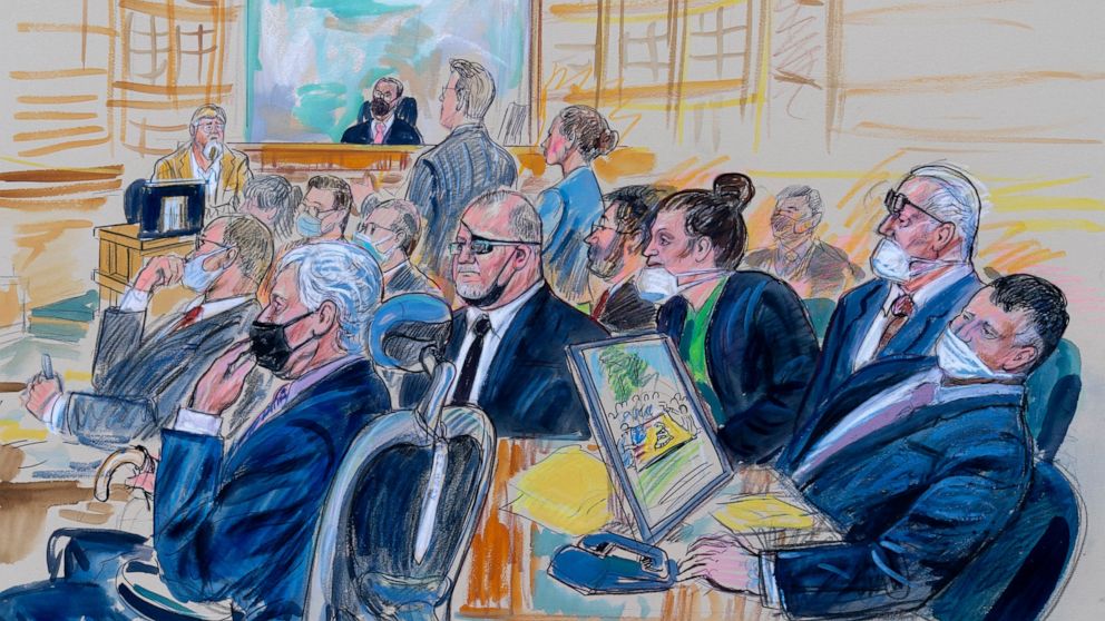 FILE - This artist sketch depicts the trial of Oath Keepers leader Stewart Rhodes and four others charged with seditious conspiracy in the Jan. 6, 2021, Capitol attack, in Washington, Oct. 6, 2022. Shown above are, witness John Zimmerman, who was par