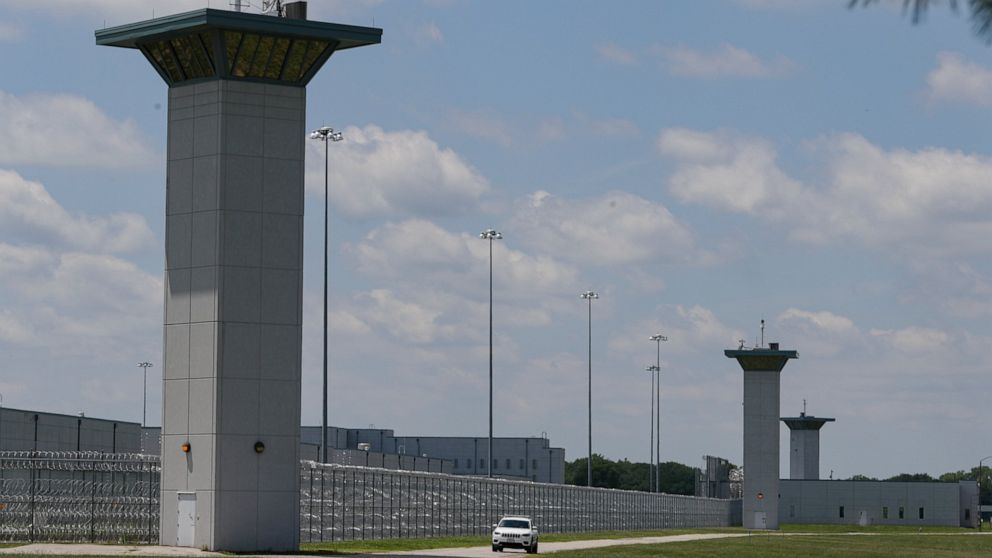 FILE - In this July 17, 2020, file photo the federal prison complex in Terre Haute, Ind., is shown. The killing of an inmate who was beaten to death at a federal lockup in Indiana is under investigation by the FBI, according to documents obtained by 