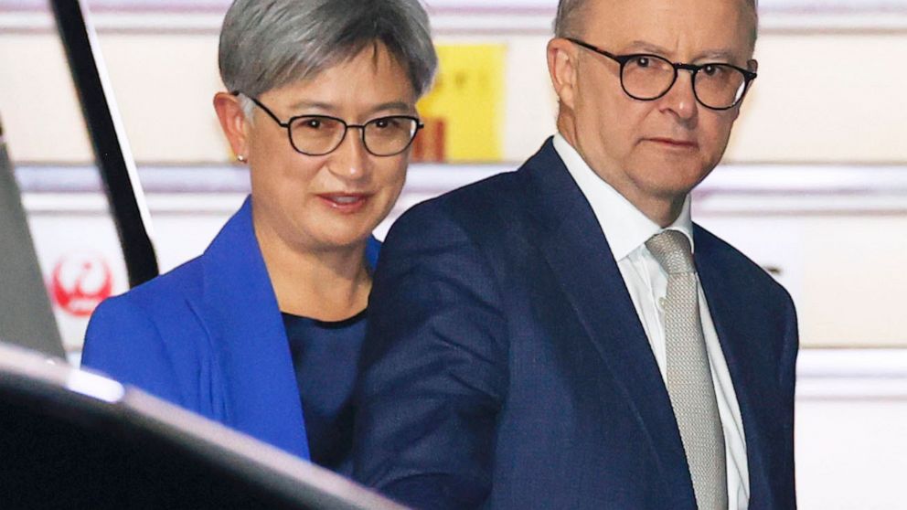 Australian Prime Minister Anthony Albanese, right, and Foreign Minister Penny Wong arrive at Haneda International Airport in Tokyo, Monday, May 23, 2022. The newly sworn-in Australian Prime Minister Albanese is scheduled to attend a gathering in Toky
