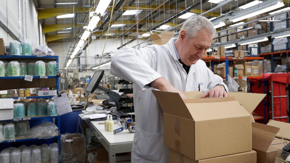 In this photo taken on Thursday, Jan. 17, 2019, Michael O'Brien, Supervisor at Clarity_The Soap Co. prepares an order at the premises in London. Amid the rancor and political bickering that this week sent Prime Minister Theresa May's Brexit deal down
