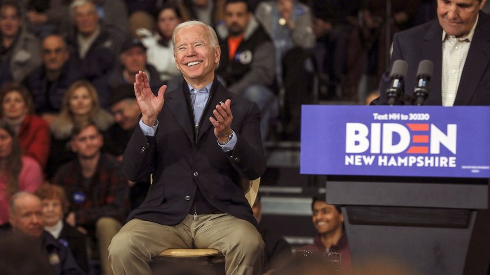 Democratic presidential candidate and former Vice President Joe Biden reacts while John Kerry, the former secretary of state and 2004 Democratic presidential nominee speaks at a campaign event in Nashua, N.H. Sunday, Dec. 8, 2019. (AP Photo/Cheryl Senter)
