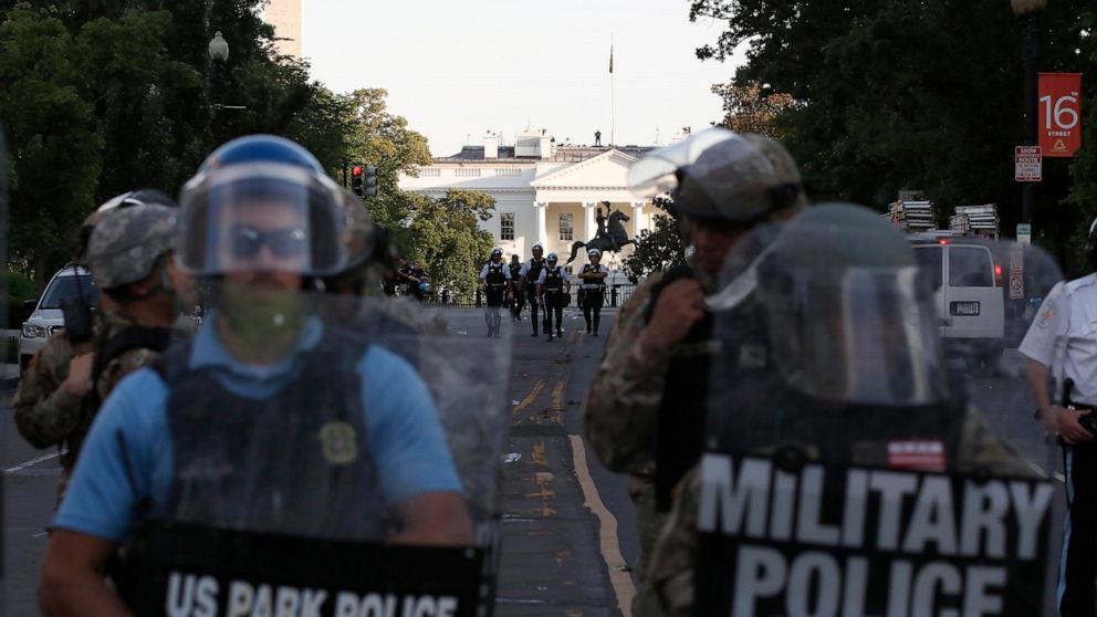 Police clear the area around Lafayette Park and the White House as demonstrators gather to protest the death of George Floyd, Monday, June 1, 2020, in Washington. Floyd died after being restrained by Minneapolis police officers. (AP Photo/Alex Brandon)