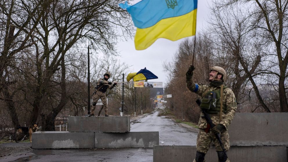 FILE - Ukrainian soldiers celebrate at a check point in Bucha, in the outskirts of Kyiv, Ukraine, April 3, 2022. Kyiv was a Russian defeat for the ages. It started poorly for the invaders and went downhill from there. (AP Photo/Rodrigo Abd, File)