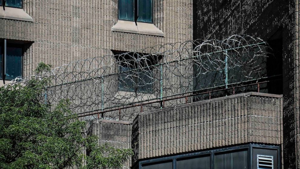 FILE - This Aug. 10, 2019, shows razor wire fencing at the Metropolitan Correctional Center in New York. Inmates and advocates said numerous inmates exhibiting flu-like symptoms were not tested or quarantined at several facilities, including at FCI Y