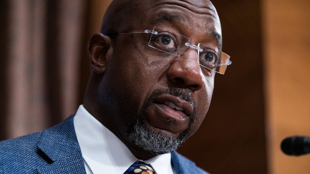 FILE - Sen. Raphael Warnock, D-Ga., questions Treasury Secretary Janet Yellen as she testifies before the Senate Banking, Housing, and Urban Affairs Committee hearing, May 10, 2022, on Capitol Hill in Washington. Herschel Walker will represent the Re