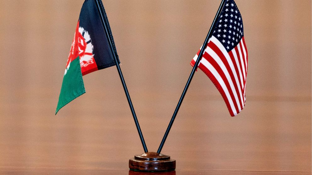 FILE - The flags of Afghanistan and the United States are seen on the table before a meeting at the Pentagon in Washington, June 25, 2021. The United States has taken control of Afghanistan's embassy in Washington and the country's consulates in New 