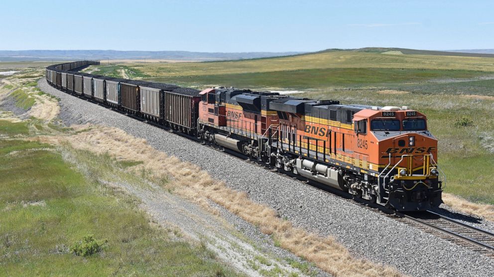 FILE - A BNSF railroad train hauling carloads of coal from the Powder River Basin of Montana and Wyoming is seen east of Hardin, Mont., on July 15, 2020. Business and top officials are bracing for the possibility of a nationwide rail strike on Friday