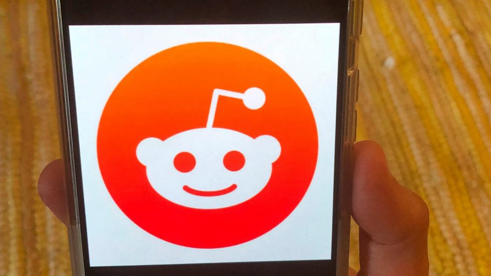 This Monday, June 29, 2020 photo shows the Reddit logo on a mobile device in New York. Reddit, an online comment forum that is one of the internet's most popular websites, on Monday, June 29, 2020 banned a pro-Donald Trump forum as part of a crackdow