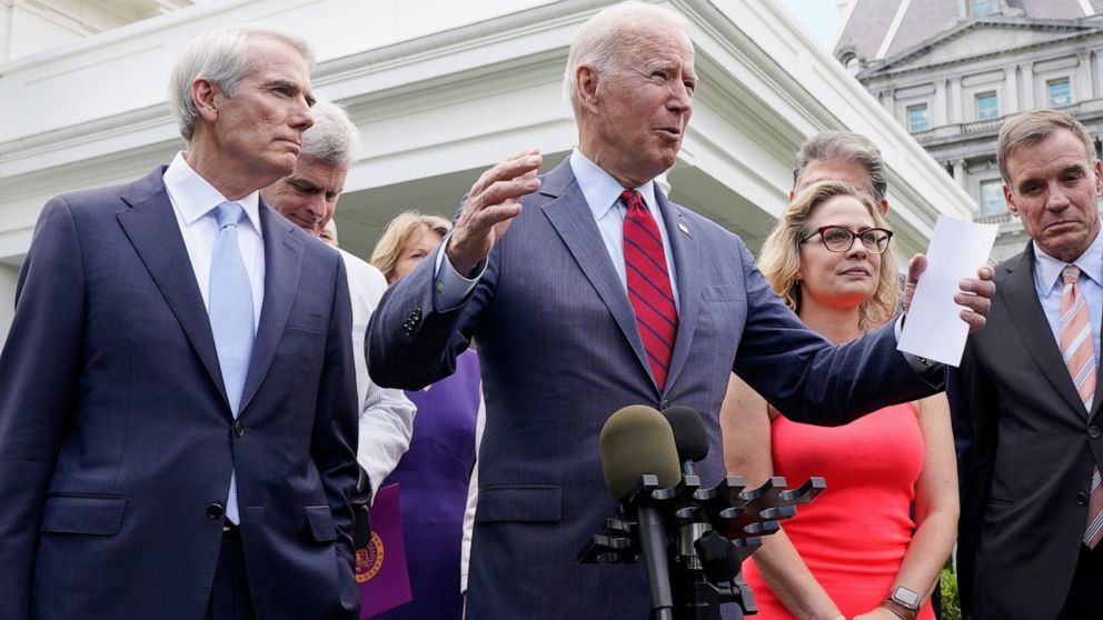 President Joe Biden, with a bipartisan group of senators, speaks Thursday June 24, 2021, outside the White House in Washington. Biden invited members of the group of 21 Republican and Democratic senators to discuss the infrastructure plan. (AP Photo/