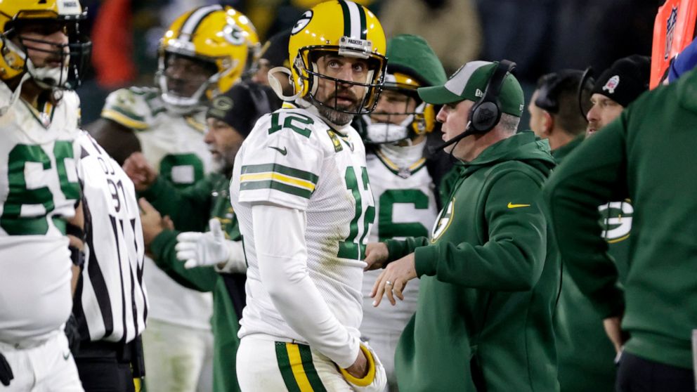 Green Bay Packers quarterback Aaron Rodgers (12) walks off the field late in the second half of an NFL football game against the Tennessee Titans Thursday, Nov. 17, 2022, in Green Bay, Wis. (AP Photo/Mike Roemer)