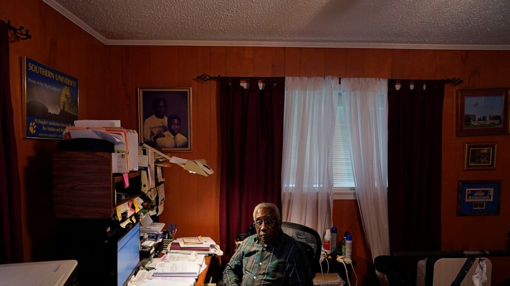 Press Robinson poses for a photo at his home in Baton Rouge, La., Wednesday, Aug. 24, 2022. When he registered to vote in 1963 he was handed a copy of the U.S. Constitution, told to read it aloud and interpret it. Robinson and activists say that Blac