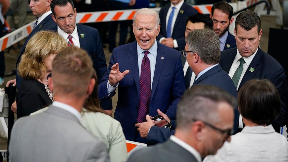 President Joe Biden talks with guests after speaking about infrastructure spending at the La Crosse Municipal Transit Authority, Tuesday, June 29, 2021, in La Crosse, Wis. (AP Photo/Evan Vucci)