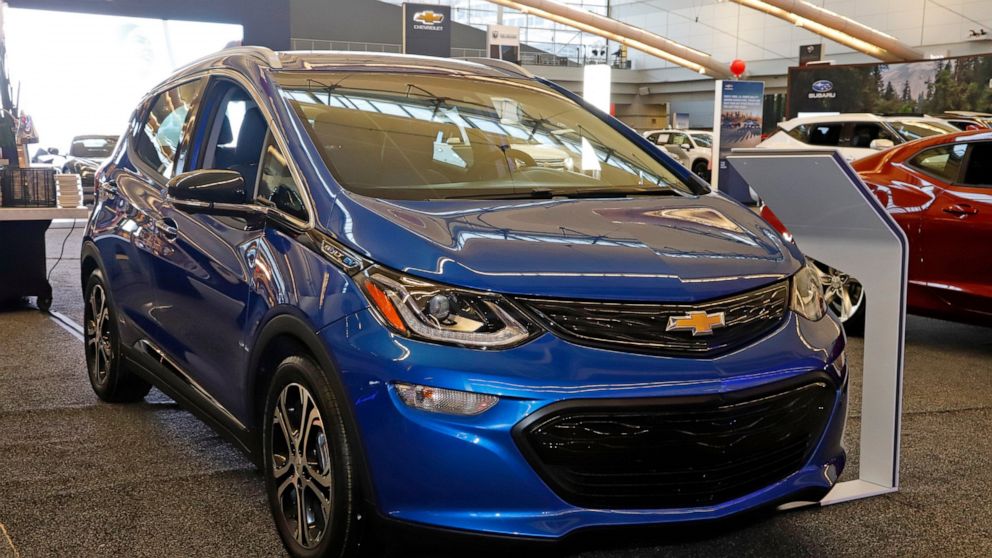 FILE - This Thursday, Feb. 13, 2020 file photo shows a 2020 Chevrolet Bolt EV on display at the 2020 Pittsburgh International Auto Show in Pittsburgh. General Motors is recalling all Chevrolet Bolt electric vehicles sold worldwide to fix a battery pr