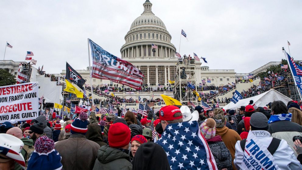FILE - Rioters loyal to President Donald Trump rally at the U.S. Capitol in Washington on Jan. 6, 2021. Samuel Christopher Montoya, a Texas man described as a video editor for the conspiracy theory-promoting Infowars website, pleaded guilty on Monday