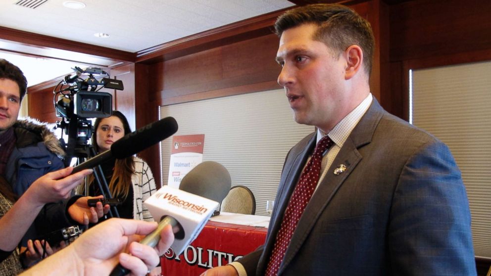 Wisconsin Republican Senate candidate Kevin Nicholson speaks with reporters in Madison, Wis., Jan. 30, 2018. Federal records show that Nicholson's parents have donated the maximum amount to the campaign of their son's Democratic rival, Sen. Tammy Baldwin.