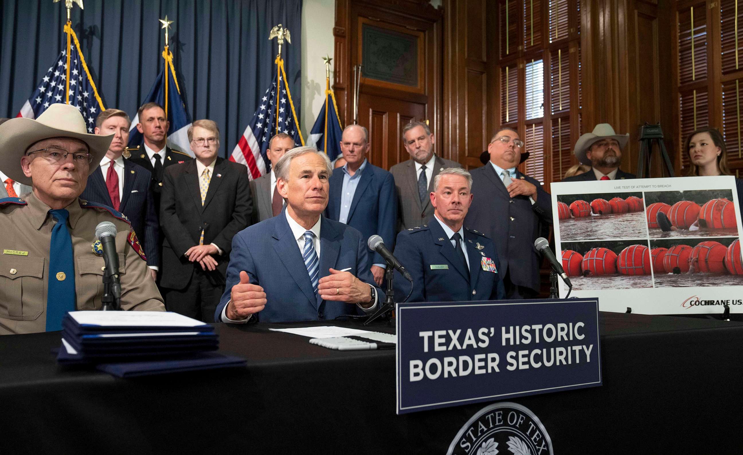 PHOTO: Texas Republican Governor Greg Abbott signs several bills to strengthen Texas border security, June 8, 2023, including deployment of a 1000-foot floating barrier in the middle of the Rio Grande where groups of migrants try to cross.