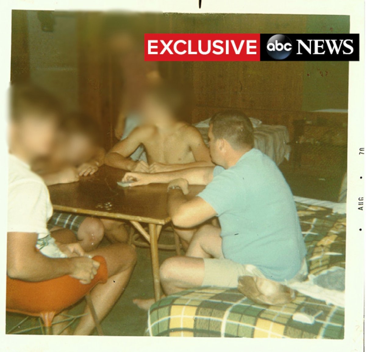 PHOTO: Dennis Hastert, right, plays cards with members of the Explorer's Club in the Bahamas.