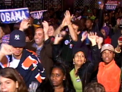Picture of people celebrating Obamas victory in Harlem.