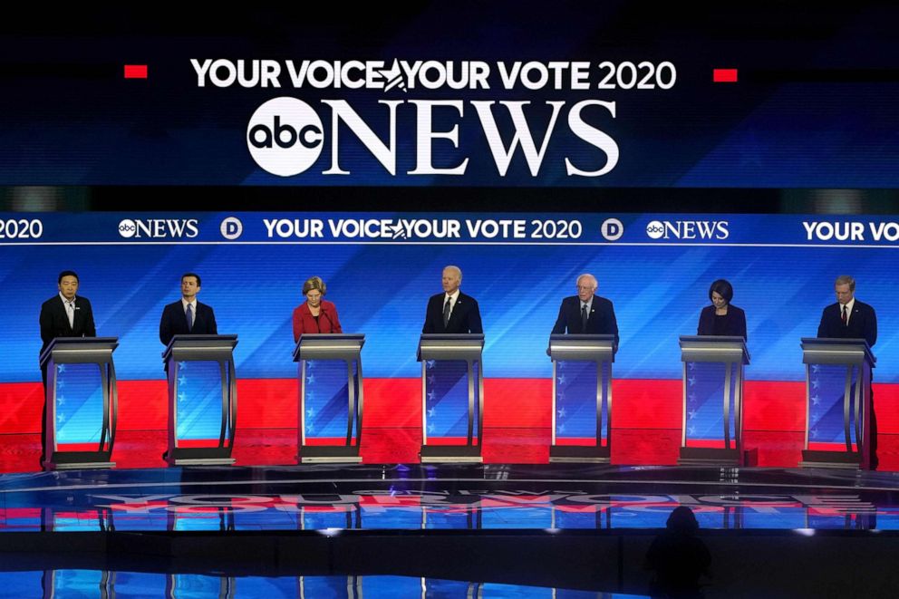 PHOTO: Democratic presidential hopefuls arrive onstage for the eighth Democratic primary debate of the 2020 presidential campaign season co-hosted by ABC News, WMUR-TV and Apple News at St. Anselm College in Manchester, New Hampshire, on February 7, 2020.