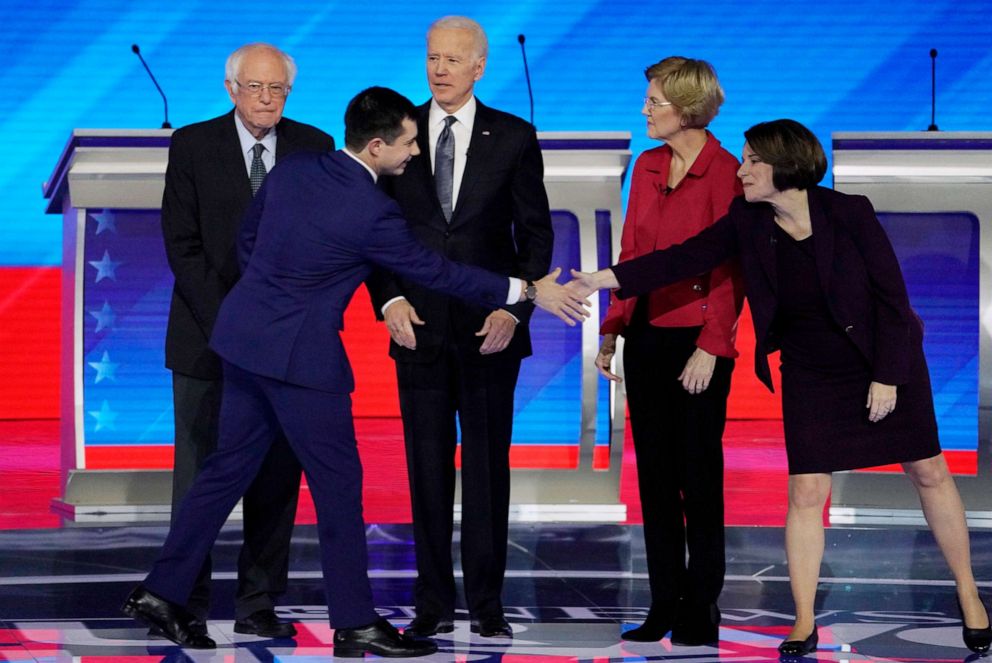 PHOTO: Pete Buttigieg shakes hands with Sen. Amy Klobuchar as Sen. Bernie Sanders, former Vice President Joe Biden and Sen. Elizabeth Warren look on at the Democratic 2020 presidential debate at Saint Anselm College in Manchester, N.H., Feb. 7, 2020.