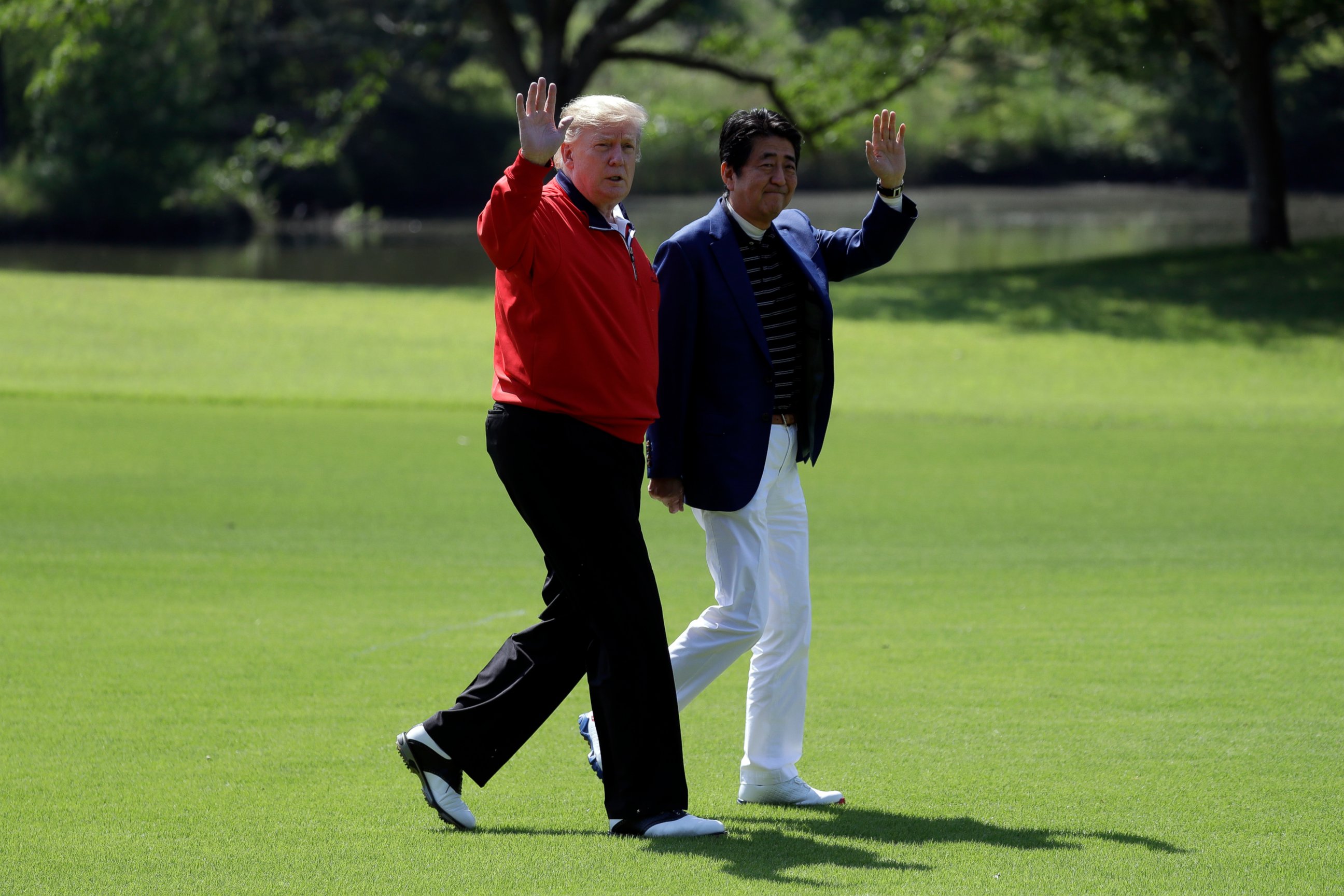 PHOTO: President Donald Trump walks with Japanese Prime Minister Shinzo Abe before playing a round of golf at Mobara Country Club, Sunday, May 26, 2019, in Chiba, Japan.