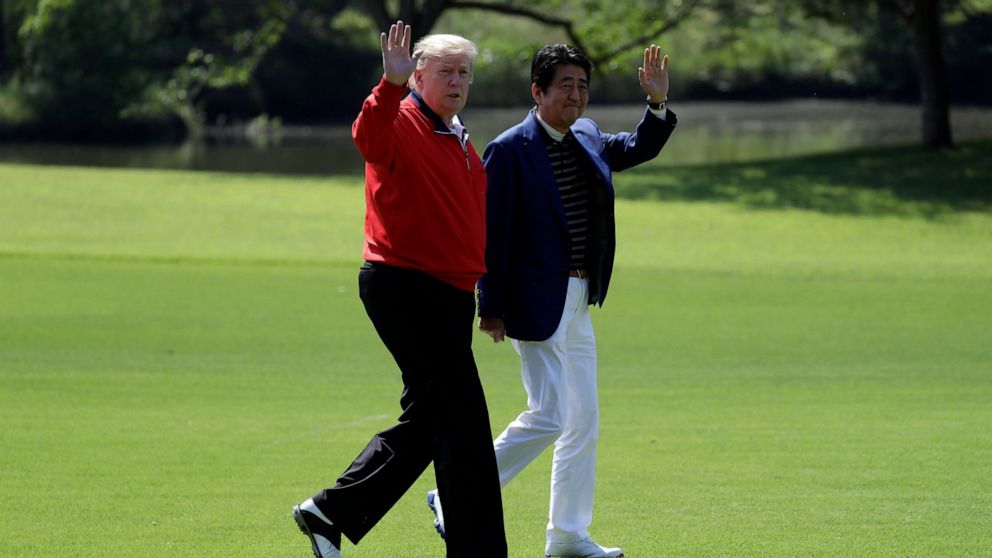 PHOTO: President Donald Trump walks with Japanese Prime Minister Shinzo Abe before playing a round of golf at Mobara Country Club, Sunday, May 26, 2019, in Chiba, Japan.