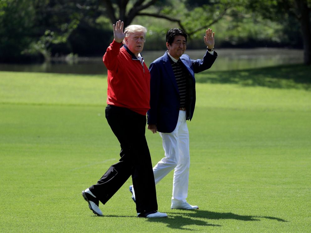PHOTO: President Donald Trump walks with Japanese Prime Minister Shinzo Abe before playing a round of golf at Mobara Country Club, Sunday, May 26, 2019, in Chiba, Japan.