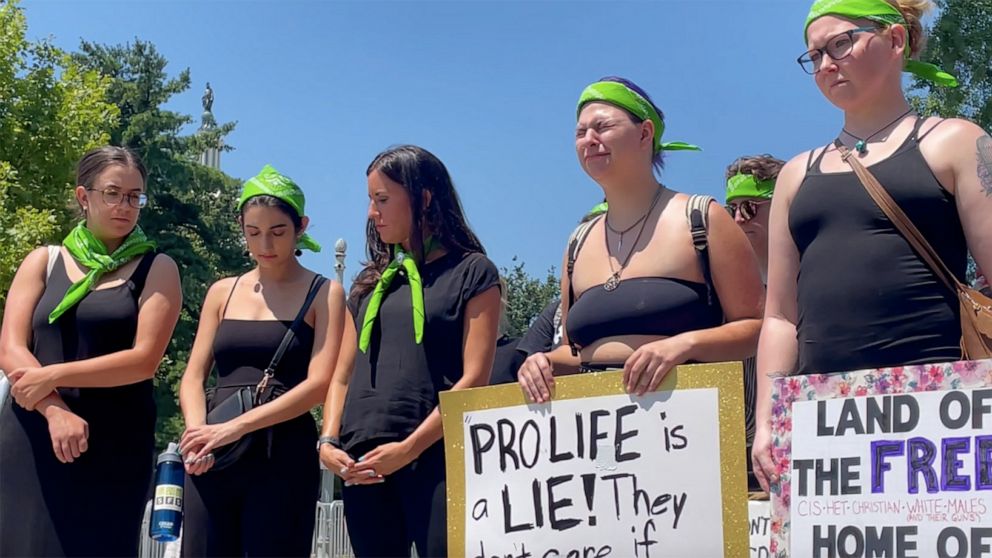 PHOTO: Abortion suporters hold signs protesting outside the Supreme Court in Washington, D.C., on July 11, 2022.